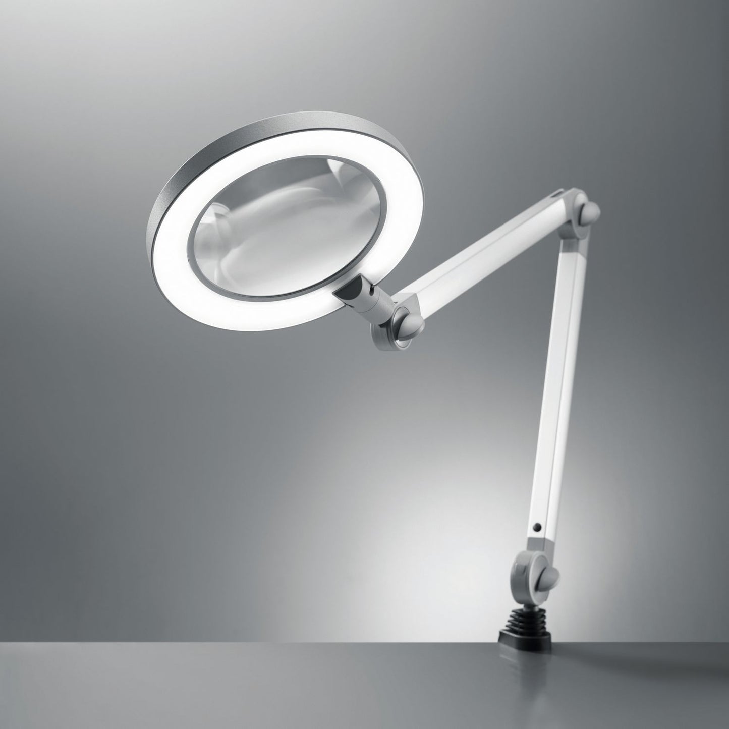 Lampe loupe Waldmann MLD 750/850/D dimmable 3,5 dpt avec pince de table en gris